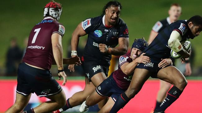 Marika Koroibete tries to slip through the Reds defence the first time they met this season.