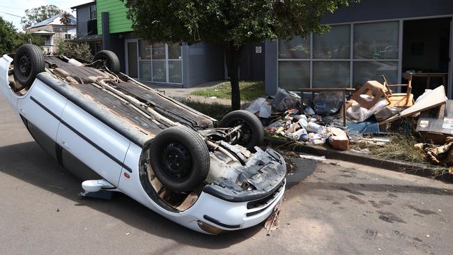 An overturned car in Dawson St Lismore in the aftermath of the devastating floods. Photograph: Jason O'Brien