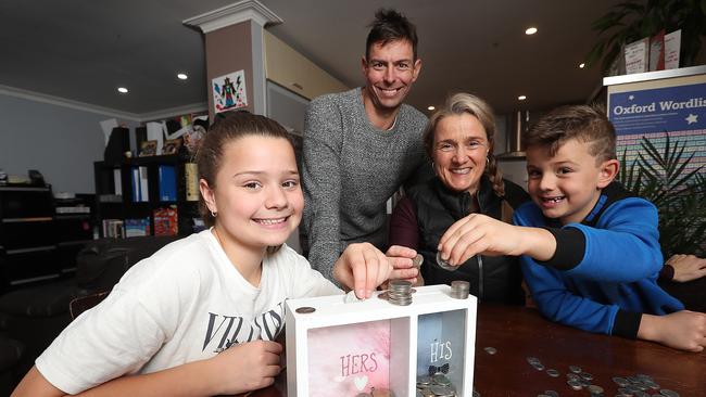 Tamara and Scott Riddell and their children Heidi, 10 and Nate, 7 are looking at better ways to manage their personal finances. Picture: Alex Coppel.