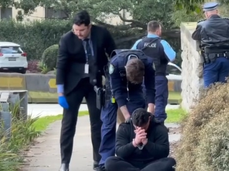 Screen shots from Channel Seven News of the 2 men in balaclavas who were arrested after being spotted in George Street in Dover Heights armed with a gun near the home of John Ibrahim. Picture: Channel 7