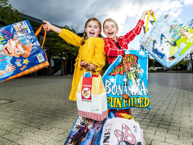 Seven-year-old Peggy Mackenzie and eight-year-old Esther McKeering at Brisbane Showgrounds with showbags for EKKA 2021, Friday, July 9, 2021 - Picture: Richard Walker