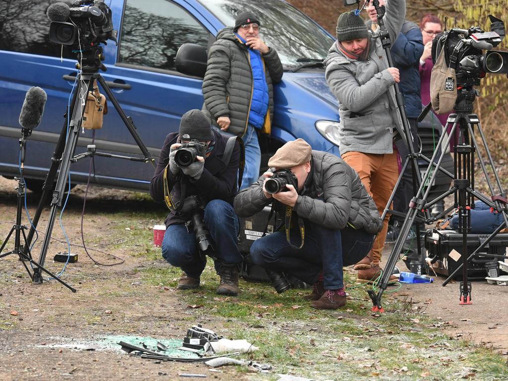 News media film broken glass and car parts on the road side near to the Sandringham Estate, England, where Prince Philip was involved in a road accident. Picture: AP