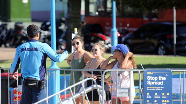 Young girls argue with a lifeguard. Picture: MATRIXNEWS