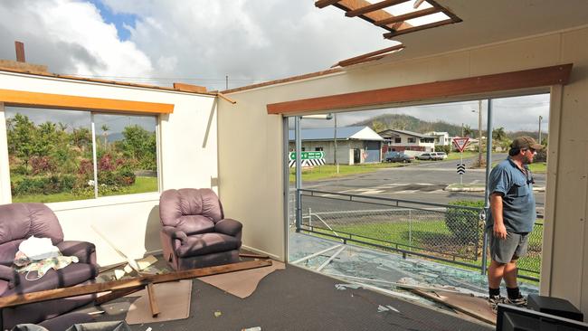 Jamie Faulks in the remains of his Silkwood home that was badly damaged in Cyclone Yasi. Picture: Evan Morgan