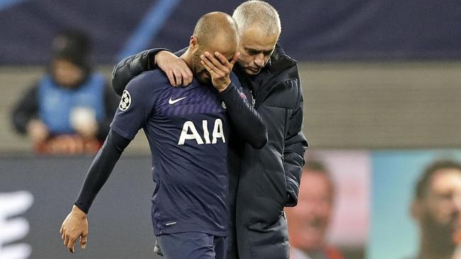 Tottenham's manager Jose Mourinho, right, comforts Lucas Moura after the club was knocked out of the Champions League Picture: AP