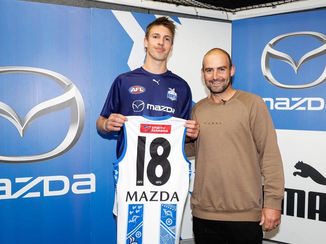 North Melbourne debutant Wil Dawson was handed his jumper by Ben Cunnington. Dylan Burns/AFL Photos via Getty Images)