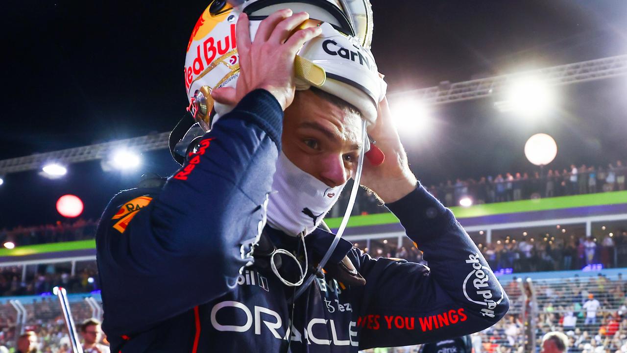 SINGAPORE, SINGAPORE - OCTOBER 02: Max Verstappen of the Netherlands and Oracle Red Bull Racing prepares to drive on the grid during the F1 Grand Prix of Singapore at Marina Bay Street Circuit on October 02, 2022 in Singapore, Singapore. (Photo by Mark Thompson/Getty Images,)