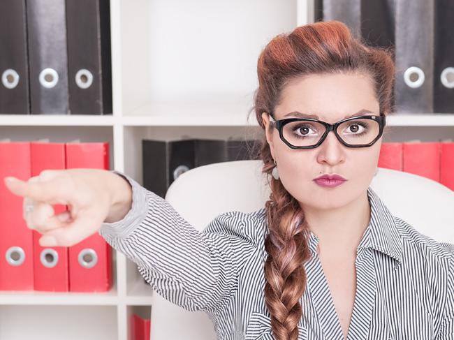 CAREERS: Angry business woman boss pointing out in office. Dismissal concept