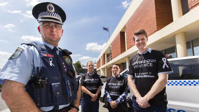 Inspector Paul Kremer, Senior Constable Michelle Gittoes, Van Tho Le, from Macarthur Family and Youth Services, and Senior Constable David Blom prepare to take part in the White Ribbon Day Convoy in the Macarthur region on Friday, September 24. Picture: Matthew Vasilescu