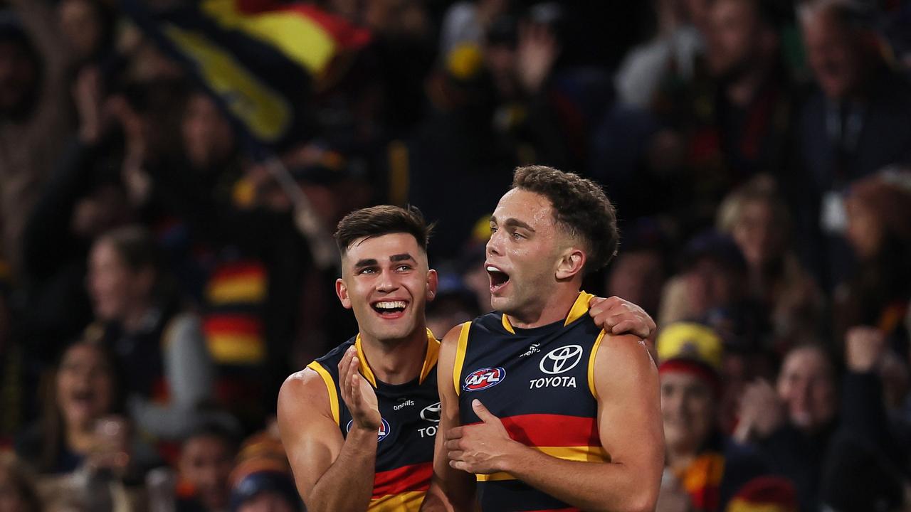 ADELAIDE, AUSTRALIA - MAY 02: Lachlan Sholl and Josh Rachele of the Crows celebrate a goal during the 2024 AFL Round 08 match between the Adelaide Crows and the Port Adelaide Power at Adelaide Oval on May 02, 2024 in Adelaide, Australia. (Photo by James Elsby/AFL Photos via Getty Images)