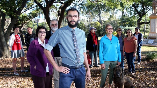 Cr Jonathan Sri with residents concerned with the widening of Lytton Rd in June 2016. Picture: Renae Droop