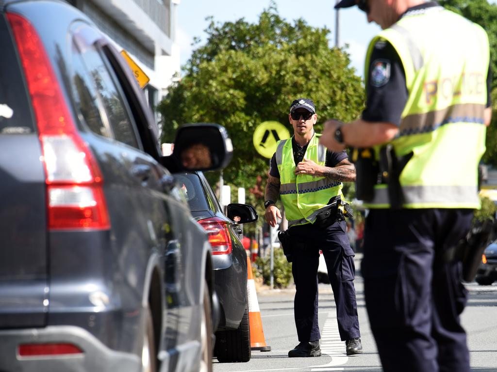 Police check cars at the Queensland-NSW border at Coolangatta. Picture: NCA NewsWire / Steve Holland