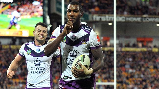 Suliasi Vunivalu celebrates scoring a try for the Storm.