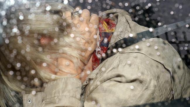 Former Labor MP Annabel Digance in the back seat of a car being driven into the Adelaide Magistrates Court on April 14. Picture: Emma Brasier