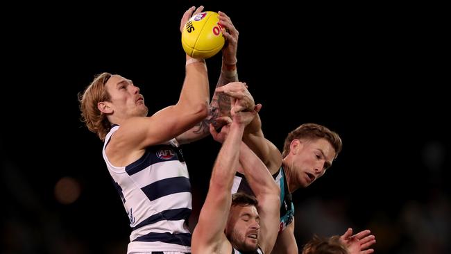 Tom Stewart soars above a pack to mark against Port Adelaide. Picture: James Elsby/AFL Photos via Getty Images.