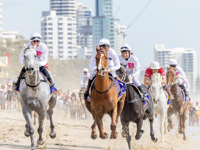 Action from the Magic Millions barrier draw beach run. Picture by Luke Marsden.