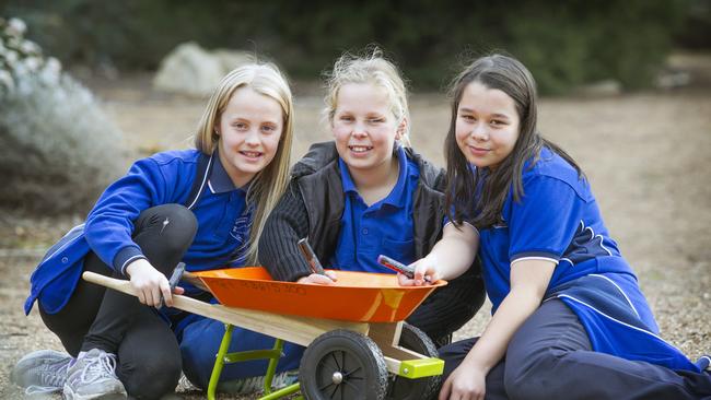 Pupils from Sydenham Hillside Primary School, Jessie, 10, Madison, 10 and Jenny, 11, will be decorating miniature wheelbarrow for the Royal Melbourne Show. Picture Sarah Matray