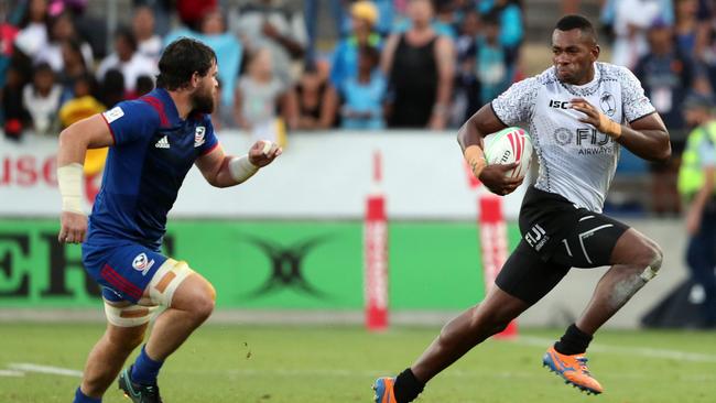 Sevuloni Mocenacagi skips away from the US defence in Hamilton. Picture: AFP