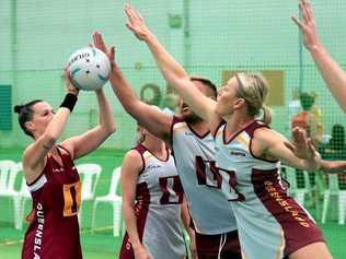 CLOSE DEFENCE: Toowoomba's Michelle Lynch (right) defends a shot on goal. The indoor netball defender will head to South Africa later this year to represent Australia at the Aged Indoor Netball World Series. Picture: PowerShots Photography