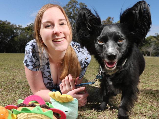 Lydia Brackin playing with and feeding her dog Elijah. Pic Annette Dew