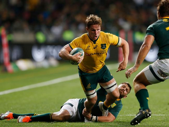 Australia's flanker Michael Hooper (C) hits the ball up. Picture: AFP