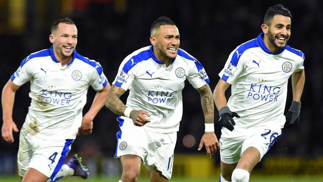 Leicester City midfielder Riyad Mahrez celebrates scoring his team's first goal with teammates Danny Drinkwater and Danny Simpson.