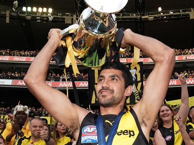 Marlion Pickett of the Tigers celebrates the win with the Premiership Cup during the 2019 AFL Grand Final between the Richmond Tigers and the GWS Giants at the MCG in Melbourne, Saturday, September 28, 2019. (AAP Image/Michael Dodge) NO ARCHIVING