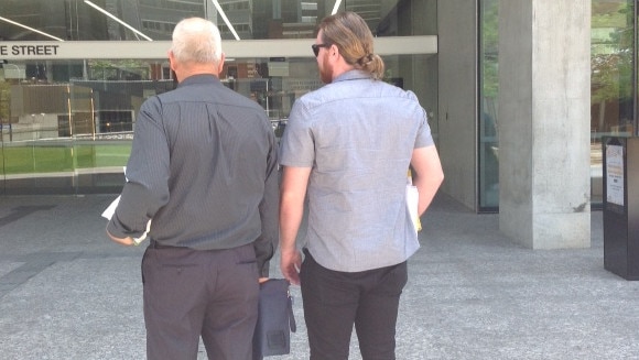 Excavator driver Warren Bruggy, left, and labourer, Daniel Boyd, who found the buried cash. Outside the Supreme Court in Brisbane.