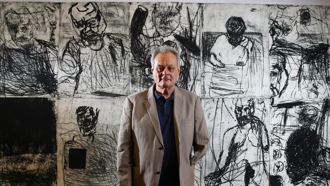 Mike Parr in his Alexandria studio in Sydney with his most recent work, a series of not yet exhibited self-portraits he started in 2016. Picture: Britta Campion