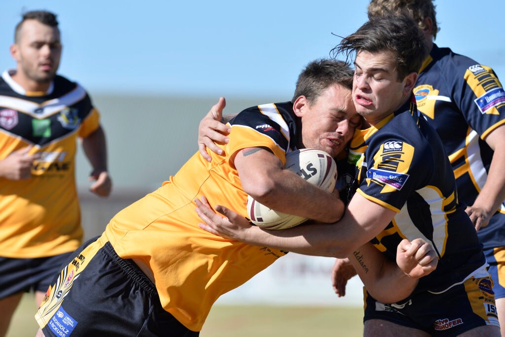 Gatton player Brendan Simpson is tackled by Cooper Bowyer of Highfields in TRL President's Cup reserve grade rugby league at Herb Steinohrt oval, Sunday, June 17, 2018. Picture: Kevin Farmer