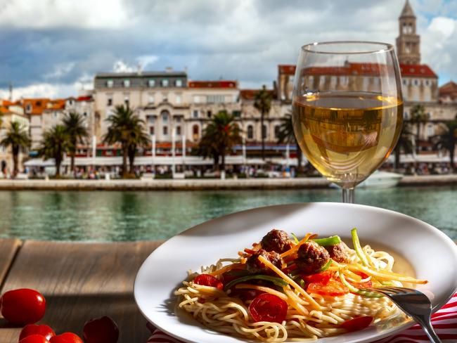 Pasta with a plate of sauce on the table in Croatia, Split.