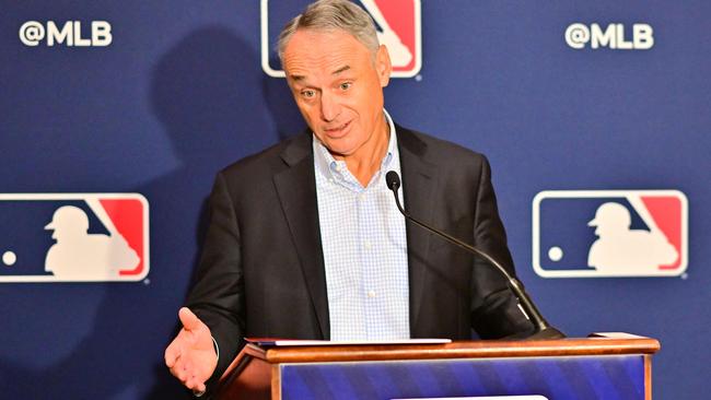 (FILES) In this file photo taken on February 10, 2022, Major League Baseball Commissioner Rob Manfred answers questions during an MLB owner's meeting at the Waldorf Astoria in Orlando, Florida. - A brief meeting between Major League Baseball officials and players union representatives on February 12, 2022, did little to allay fears the 2022 season could be delayed over economic issues. (Photo by Julio Cesar AGUILAR / GETTY IMAGES NORTH AMERICA / AFP)