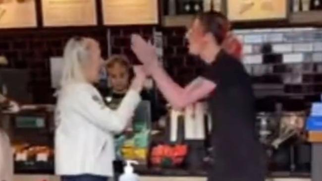 A trans Starbucks worker clashes with customers. Picture: @OliLondonTV/Twitter