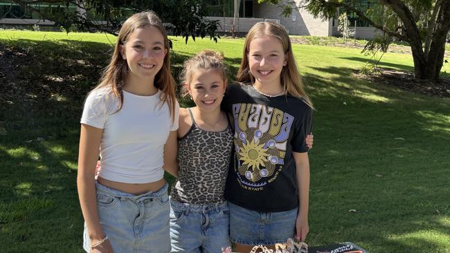 Federal election day entrepreneurs Grace Euler, Kit Euler, and Genevieve Spiers selling jewellery at Palm Beach Currumbin State High. Picture: Jacklyn O'Brien