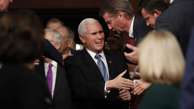 Mike Pence greets people before Donald Trump’s arrival. Picture: AP.