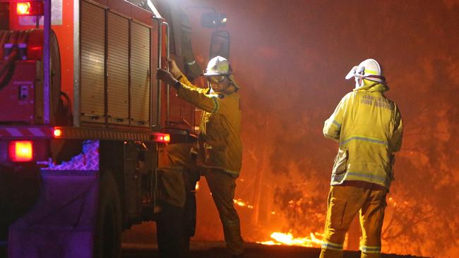 RFS firefighters work to contain a fire at Bemboka, northwest of Bega.