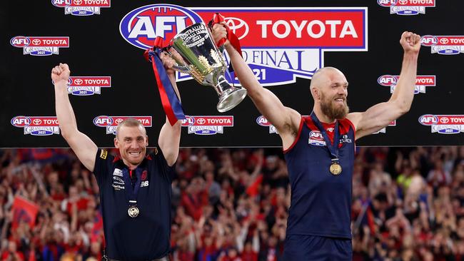 Simon Goodwin and Max Gawn lift the cup after winning the grand final. Picture: Getty Images