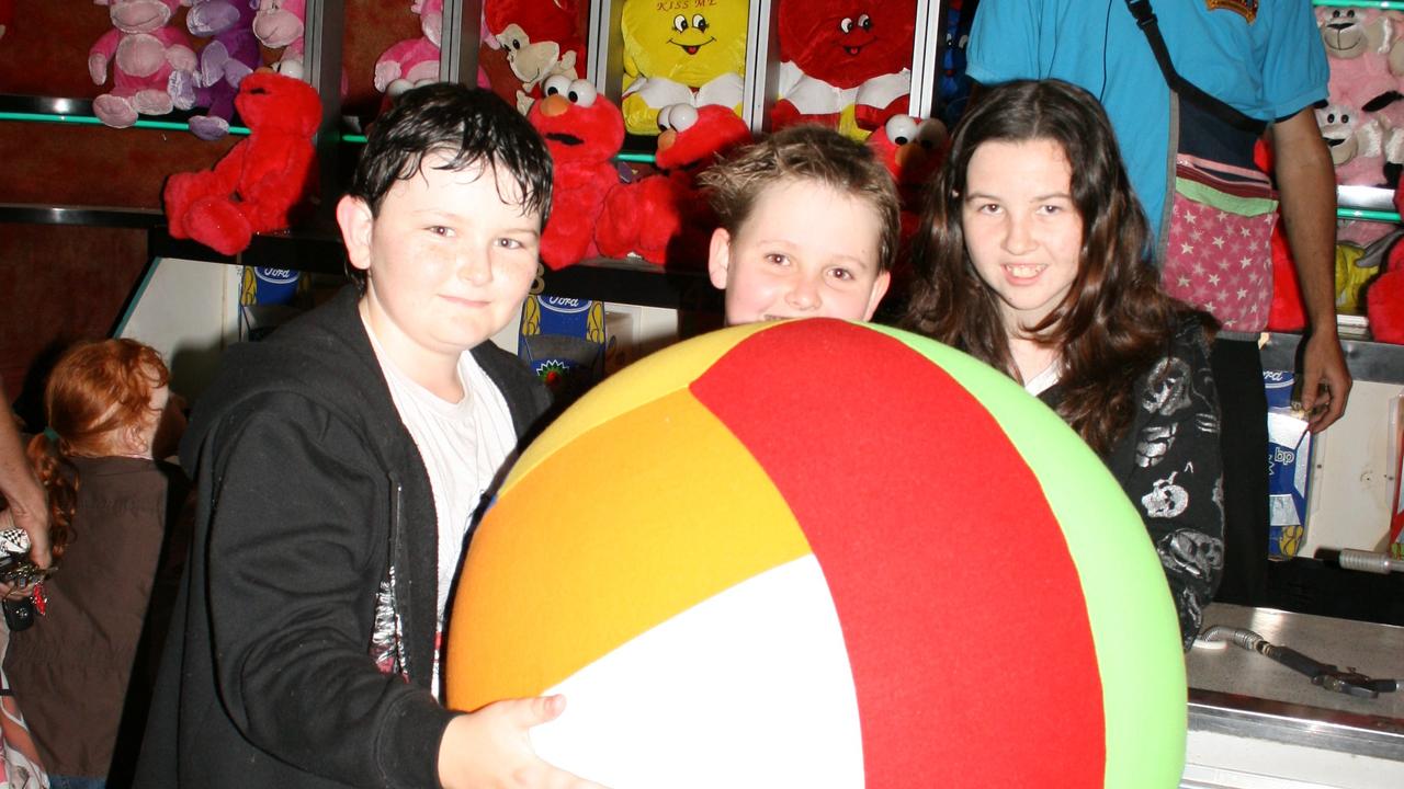 <p>Brandyn Bourke, Tyson Fett and Jaime Bourke have fun in side show alley at the Mardi Gras on Friday, October 28. Photo Deanna Millard / Warwick Daily News</p>