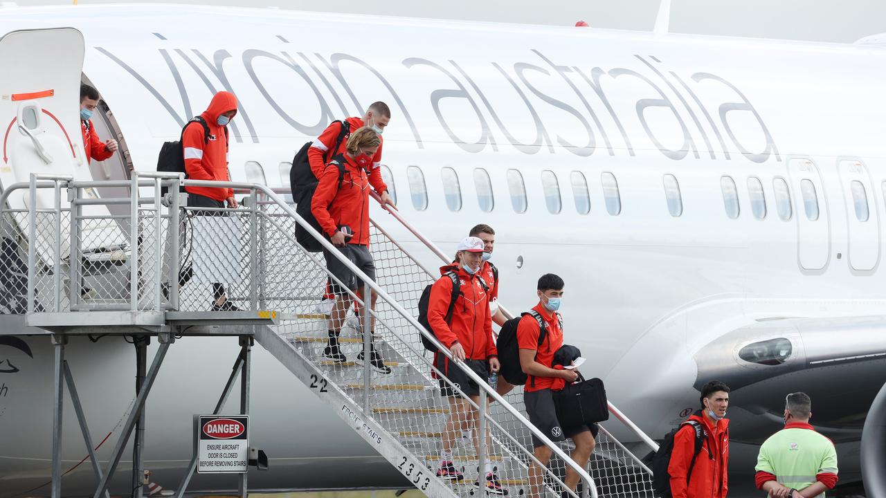 The Swans arrive at Brisbane Airport on Thursday. Picture: Liam Kidston