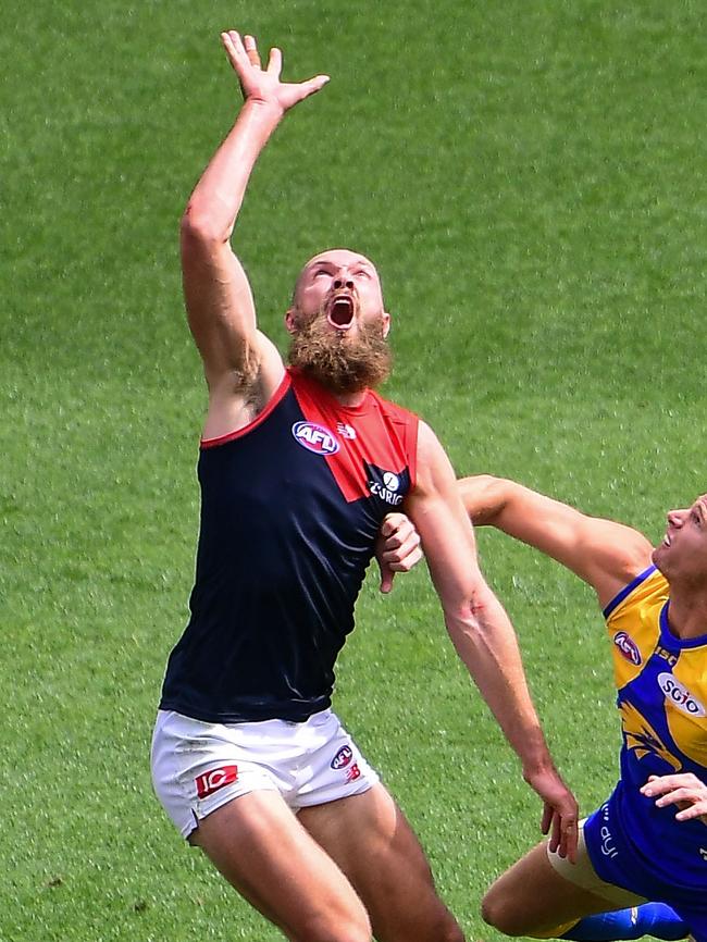 Max Gawn win the ruck tap.