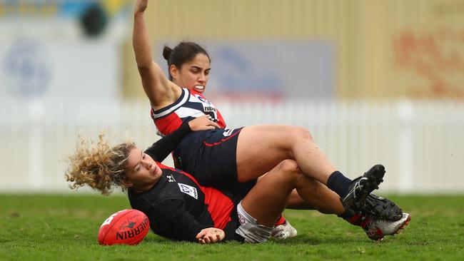 Kathleen Roe gets taken down by Essendon’s Georgie Prespakis.