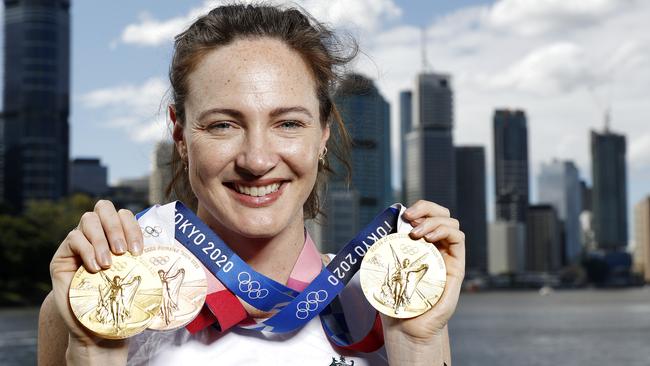 The Queensland swimmer with her Tokyo Olympics medal haul at Kangaroo Point, Brisbane.