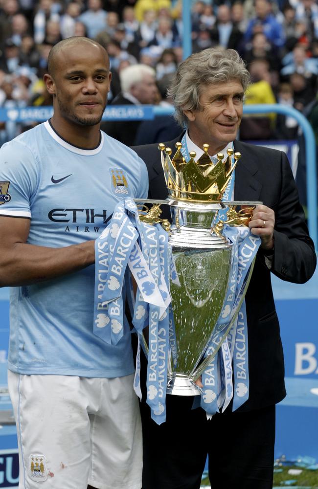 Manchester City' victorious skipper Vincent Kompany and manager Manuel Pellegrini.