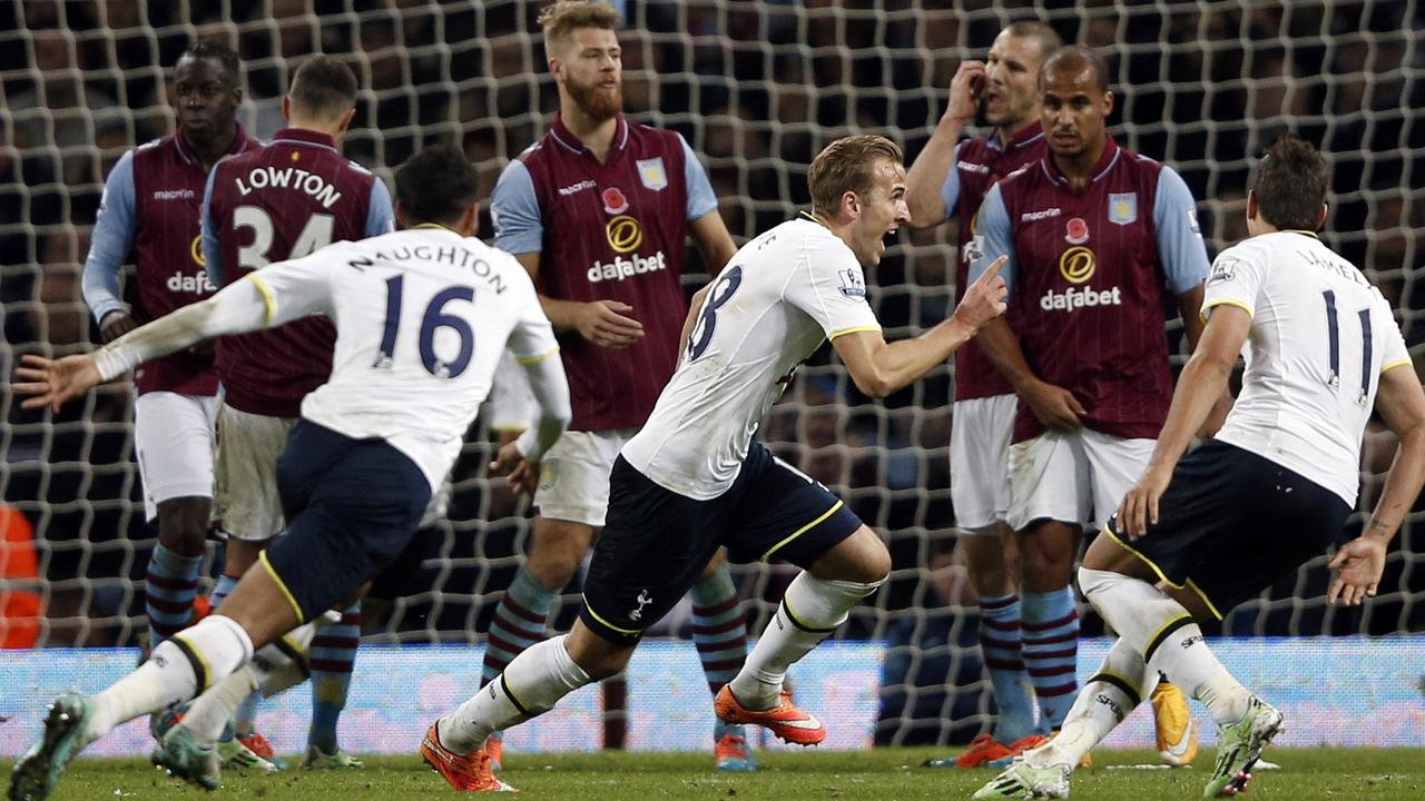 Tottenham Hotspur's English striker Harry Kane (C) celebrates scoring the second goal the English Premier League football match between Aston Villa and Tottenham Hotspur at Villa Park in Birmingham, central England, on November 2, 2014. Tottenham won the match 2-1. AFP PHOTO /ADRIAN DENNIS RESTRICTED TO EDITORIAL USE. No use with unauthorized audio, video, data, fixture lists, club/league logos or “live” services. Online in-match use limited to 45 images, no video emulation. No use in betting, games or single club/league/player publications.