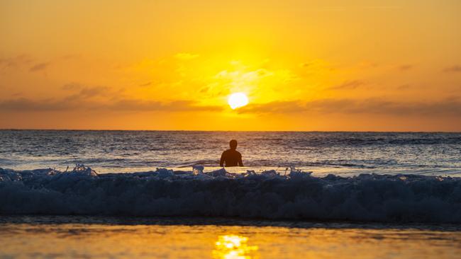 The sun rises over Bondi Beach this morning. Picture: Jenny Evans