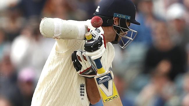 PERTH, AUSTRALIA - DECEMBER 18: James Anderson of England is stuck by a delivery from Pat Cummins of Australia  during day five of the Third Test match during the 2017/18 Ashes Series between Australia and England at WACA on December 18, 2017 in Perth, Australia.  (Photo by Ryan Pierse/Getty Images)