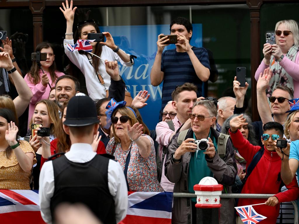 Members of the public gather outside St Pauls Cathedral with cameras in hand. Picture: Getty Images