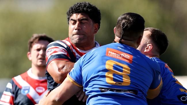 Danny Fualalo of the Rams is tackled by Che Te Rangi of the Kangaroos. (Photo by Jeremy Ng/Newscorp)