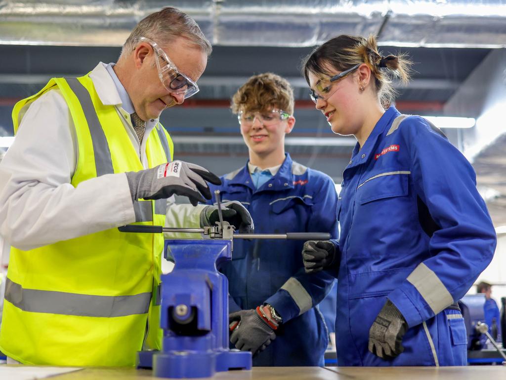 Anthony Albanese with apprentices Jacob Gillibrand and Maddison Baillie while touring the BAE workshop in Barrow-in-Furness in the North of England. Picture: Andrew Parsons / The Australian Pool Image