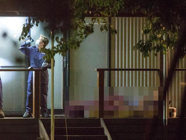 Police comb the house for clues to Darren Thornburgh’s death. Picture: Mark Stewart